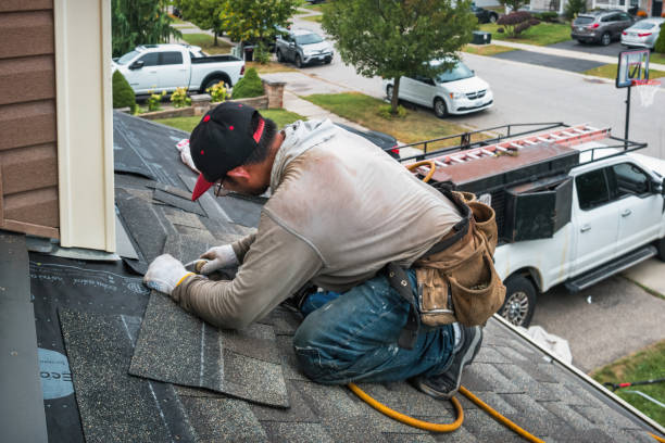Professional Roofing technician working in Brighton, CO